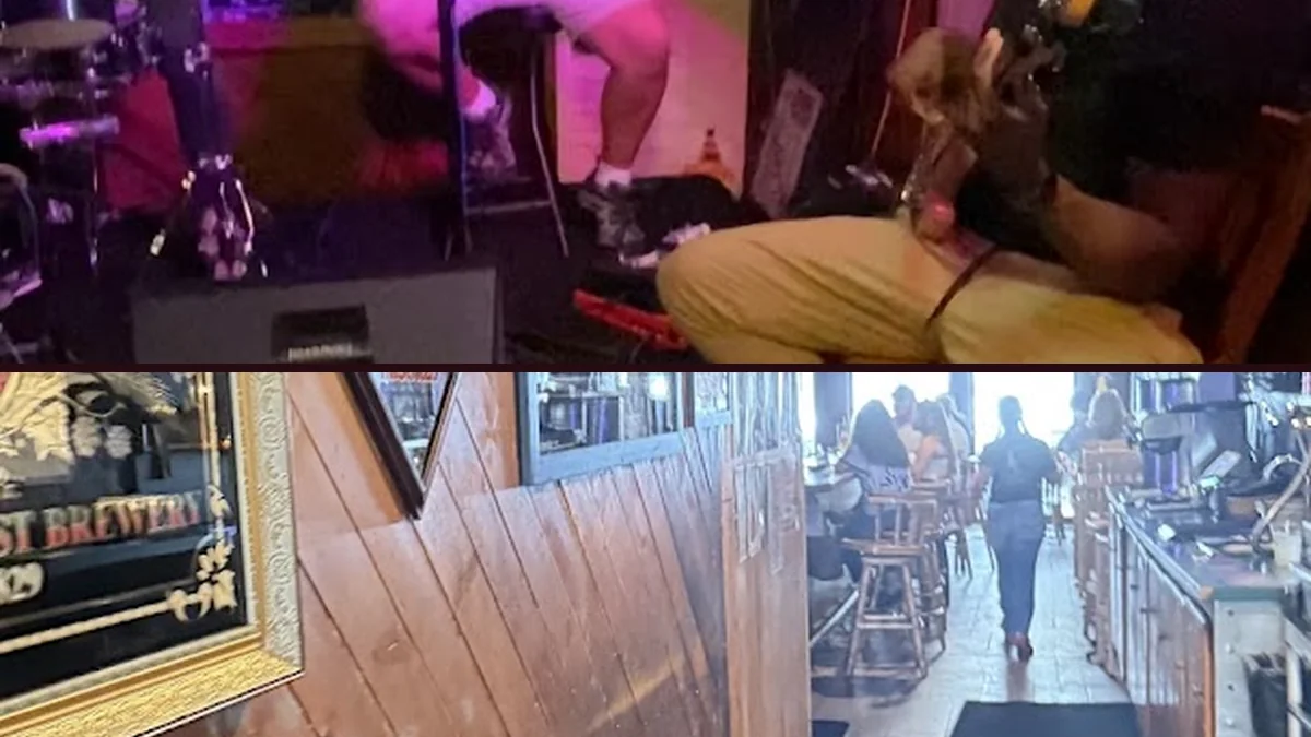 Wall-mounted screens and retro decor in a bar setting.