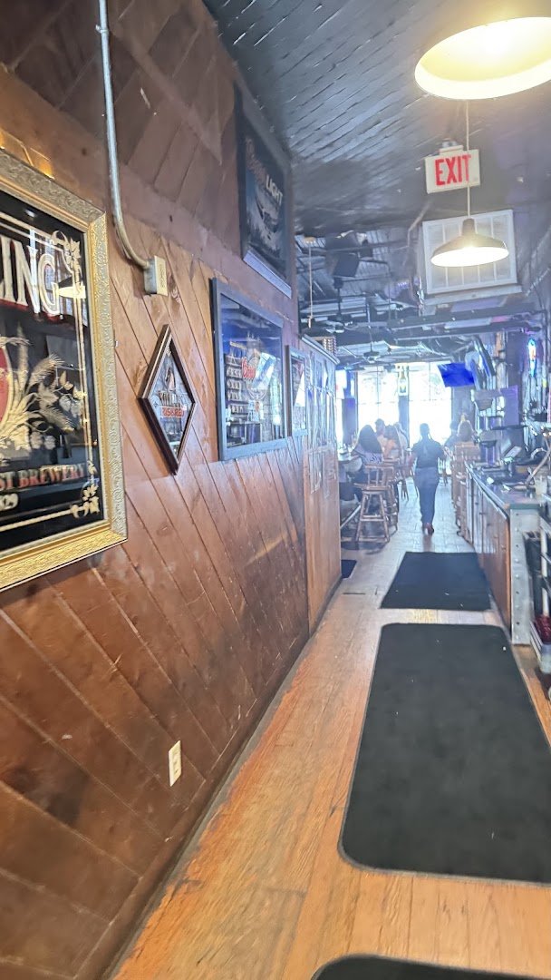 Casual restaurant seating beside a lively bar.