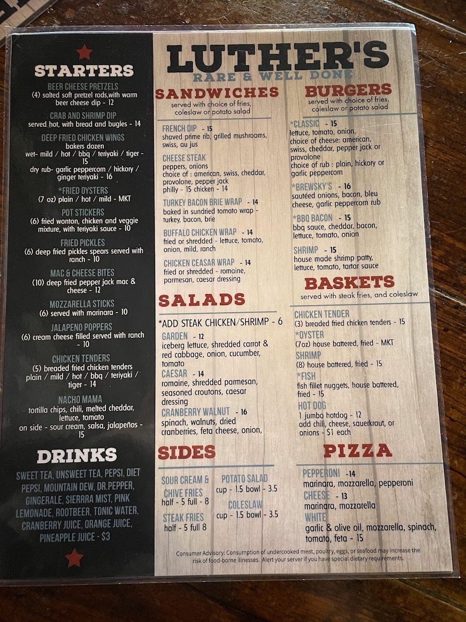 Menu board with burgers, salads, and sandwiches.